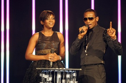 Nigerian singer D'Banj (R) and Nigerian actress Genevieve Nnaji present on December 11, 2010 the MTV Africa Music Awards ceremony in Lagos. The awards ceremony featured American rapper Rick Ross, as well as a host of top African artists including Fally Ipupa from the Democratic Republic of Congo, South Africa's Teargas and Kenya's P-Unit. AFP PHOTO / PIUS UTOMI EKPEI (Photo credit should read PIUS UTOMI EKPEI/AFP/Getty Images)